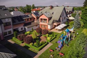 an aerial view of a house with a playground at Artis Hotel & Spa in Zamość