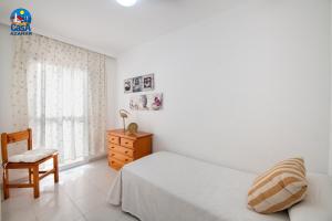 Ένα ή περισσότερα κρεβάτια σε δωμάτιο στο Apartamentos EL Rocio Casa Azahar