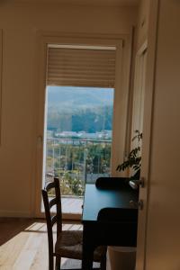 a room with a table and a window with a view at Casalloro in Valdagno