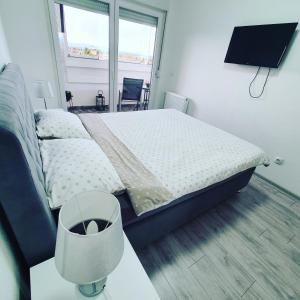 Voodi või voodid majutusasutuse XENA apartment Gradiška toas