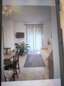 a living room with a couch and a table at Casa Silvio in Torri del Benaco