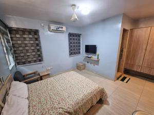 Katil atau katil-katil dalam bilik di Amazing Grace Hostel and International Serviced Apartments