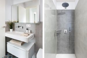 łazienka z umywalką i prysznicem w obiekcie One&lux Puerta Osario w Sewilli +8 zdjęć
