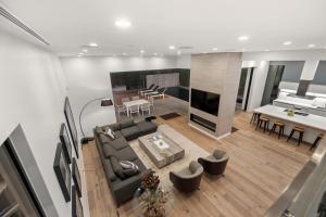 a living room with a couch and a table at Orlando Estate in Los Angeles