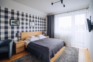 Posteľ alebo postele v izbe v ubytovaní Willa Zaciszne Centrum Augustów