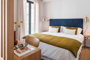 Ένα ή περισσότερα κρεβάτια σε δωμάτιο στο Magno Apartments Cabo Noval Luxury House