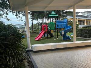 a playground with a slide in a park at relaxing city view in Manila