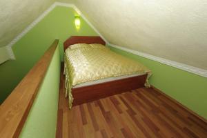 A bed or beds in a room at Nefelejcs Apartman