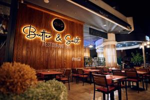 a restaurant with wooden walls and tables and chairs at Hotel Paris in Opatija +69 photos