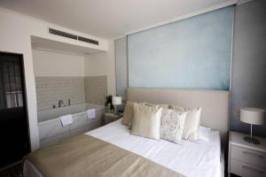 A bed or beds in a room at Thermal Hotel Visegrád
