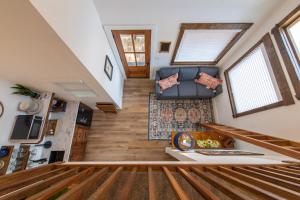 a view from the loft of a tiny house at Mockingbird Treehouse 15 MIN to MagnoliaBaylor in Elm Mott