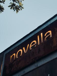 a sign that reads romeello on top of a building at Novella in Varkala