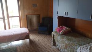Tempat tidur dalam kamar di La Casa di Rocchina