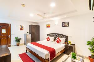 a bedroom with a large bed in a room at Octave Fairmont Suites in Bangalore