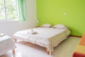 A bed or beds in a room at Simabo's Backpackers' Hostel