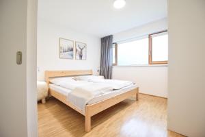 Postel nebo postele na pokoji v ubytování Toferer Textil