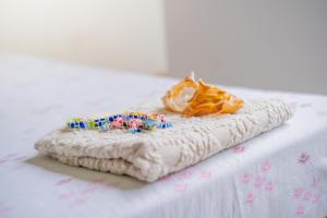 A bed or beds in a room at Simabo's Backpackers' Hostel