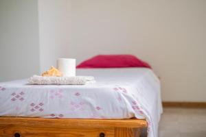 A bed or beds in a room at Simabo's Backpackers' Hostel