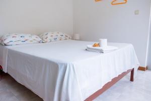 A bed or beds in a room at Simabo's Backpackers' Hostel