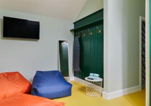 TV a/nebo společenská místnost v ubytování urchin Loft