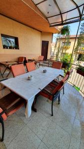 a large table and chairs on a patio at Pensiunea Select in Arad