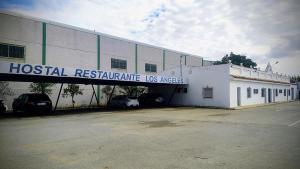 a hospital building with a sign that reads hospital legitimate osages at Pensión los Ángeles in La Puebla de Cazalla