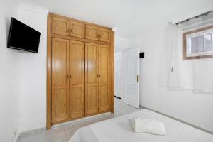 Łóżko lub łóżka w pokoju w obiekcie Apartamento Mertxe