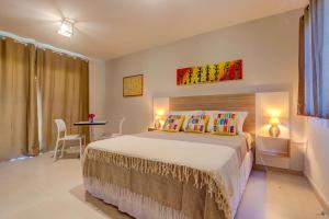 Cama ou camas em um quarto em Pousada Céu & Mar de Taipu