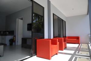 a row of orange chairs in a room at ANGEL'S DREAM RESIDENCE in Panglao