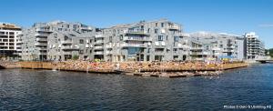 a group of people on boats in the water at Amazing luxury apartment on the waterfront! 73sqm in Oslo