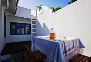 a table with a jar of honey and two chairs at Casa Alstonia in Tepus +26 photos