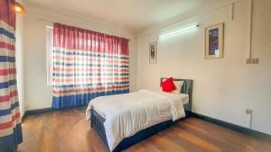 Rúm í herbergi á Cocina Mitho Chha BNB
