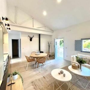 a living room with a table and a couch at Casa rural La Casona de Monterrey in Venturada