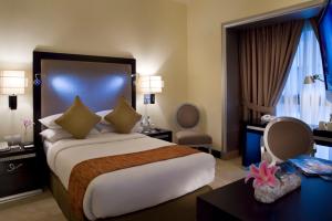 Ένα ή περισσότερα κρεβάτια σε δωμάτιο στο Mercure Gold Hotel Jumeirah Dubai by Accor