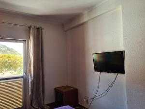 TV a/nebo společenská místnost v ubytování Machico Beach Comfort
