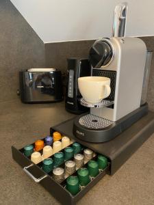 a coffee maker sitting on a counter next to a coffee machine at Apartment zum Bergkircherl - Sommercard in Großsölk