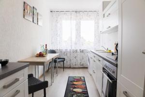 a kitchen with a table and a dining room at T&K Apartments near Messe Fair Trade Düsseldorf und Airport 2A in Duisburg