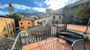 a balcony with a view of a city at Central Huge terrazza Duomo With Spectacular Views - sleeps 6 in Spoleto