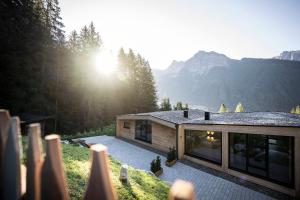 a house with a view of the mountains at Stelza Nature Chalet in Val di Vizze