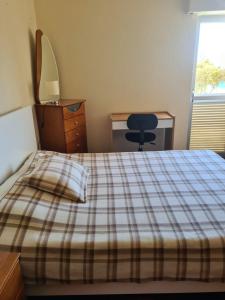 Postel nebo postele na pokoji v ubytování Machico Beach Comfort