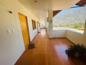 a hallway of a building with a view of a mountain at Alpamayo Casa Hotel - Restaurante in Yungay