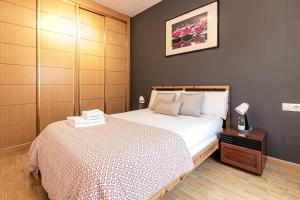 Posteľ alebo postele v izbe v ubytovaní San Rafael 1 Apartments