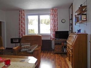 a living room with a chair and a window at Harzhaus Sorge in Sorge