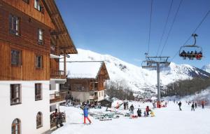 travelski home select - Résidence L'Orée des Pistes v zimě