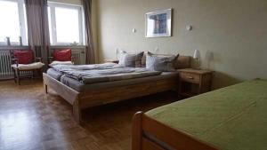 En eller flere senge i et værelse på Ferienwohnung Cecilia