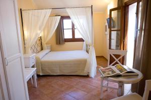 Postel nebo postele na pokoji v ubytování Hotel Barsalini + 37 fotografií