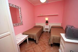 Postel nebo postele na pokoji v ubytování Hotel Barsalini