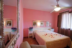 Postel nebo postele na pokoji v ubytování Hotel Barsalini
