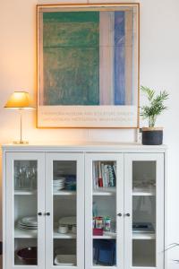 a white cabinet with a plant on top of it at Brest : charmant appartement hypercentre in Brest