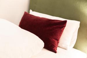 Ein Bett oder Betten in einem Zimmer der Unterkunft Hotel JUMAs